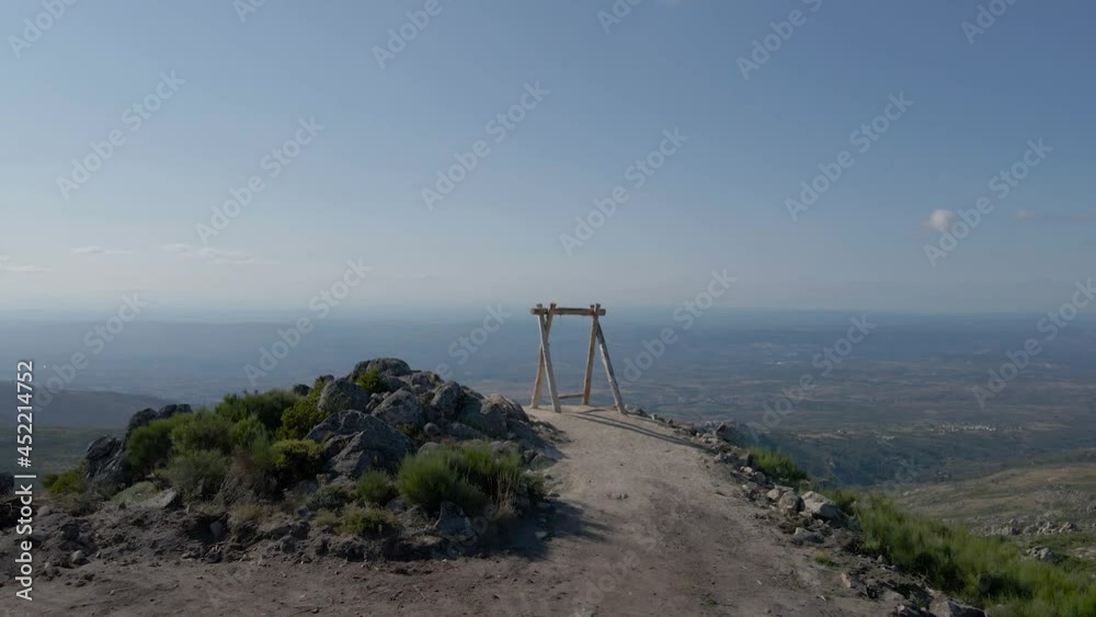 Farao swing sits on a mountaintop overlooking the valley below Folgosinho. Farao swing sits on a mountaintop overlooking the valley below Folgosinho.