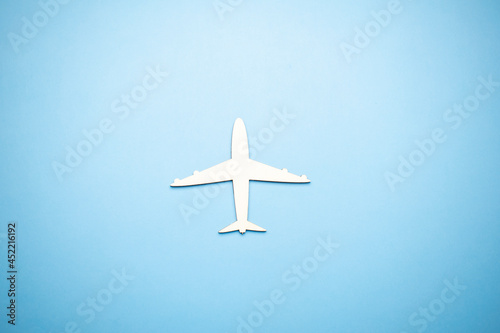 model of passenger plane on blue background