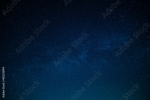 Fototapeta Naklejka Na Ścianę i Meble -  Magic night sky. Small stars twinkle very high. Astronomy, astrology, galaxy, eternity. Minimalism. There is no one in the photo. Background. Backdrop. Texture.