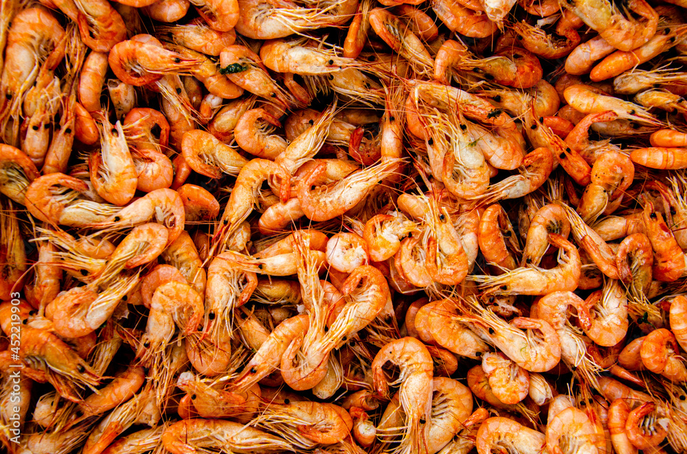 Shrimp in a box on the counter. Background for the counter. Shrimp in a box on the counter. Background for the counter.