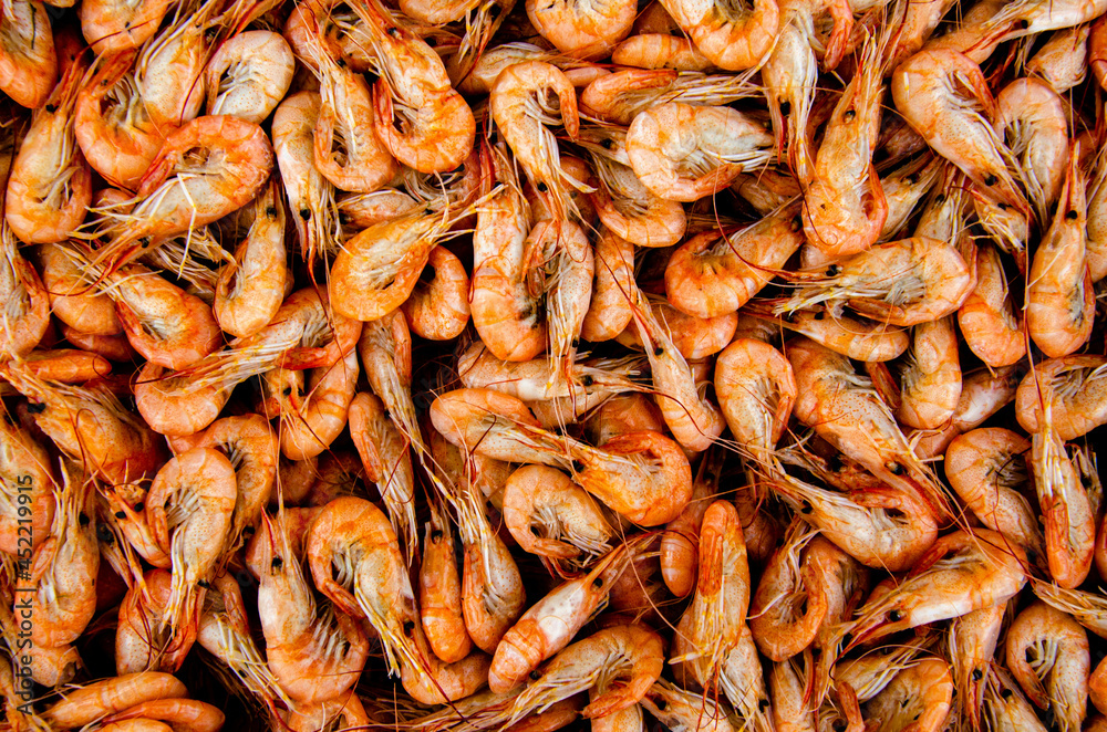 Shrimp in a box on the counter. Background for the counter. Shrimp in a box on the counter. Background for the counter.