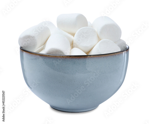 Delicious puffy marshmallows in bowl on white background