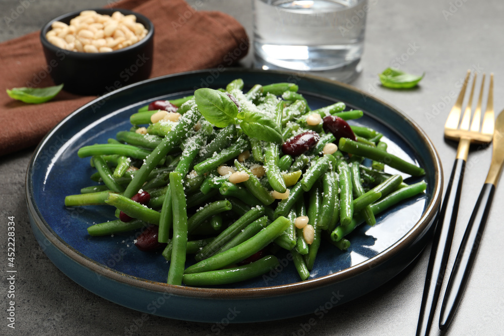 Tasty salad with green beans served on grey table Tasty salad with green beans served on grey table