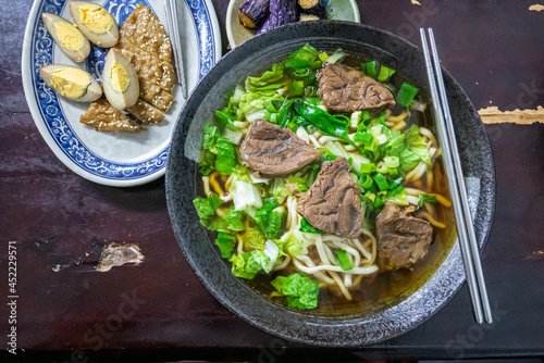 Taiwan beef noodle, a close up of Taiwanese tradition seasoned soup beef noodles with vegetable in food restaurant.