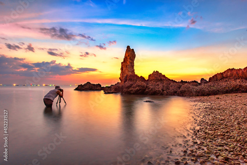 Nature photographer,Beautiful stone background on the beach at sunset in Pattaya, Thailand.
