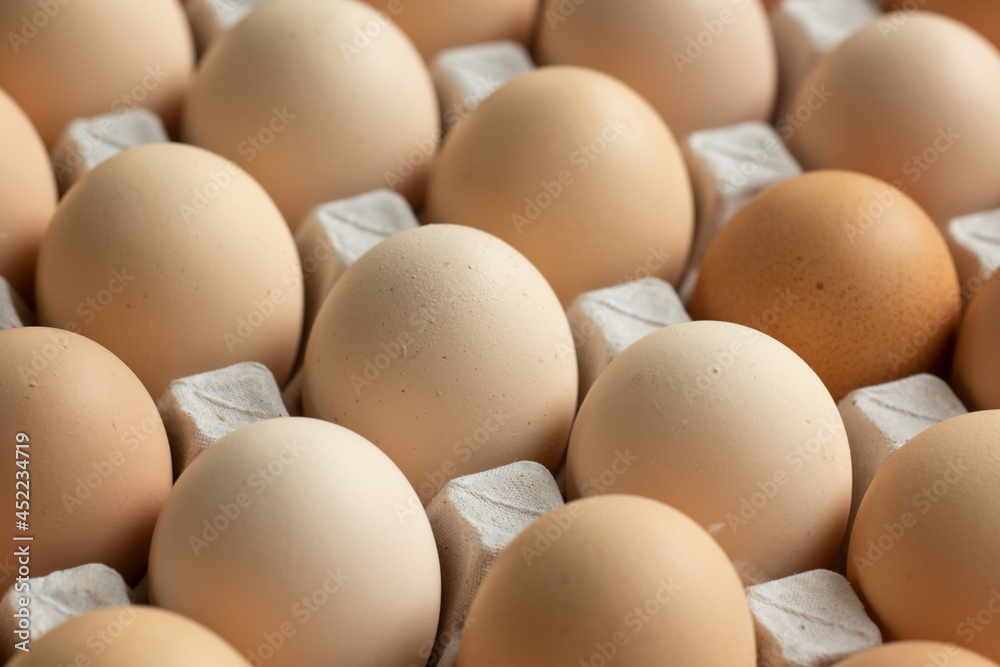 fresh hen eggs in tray paper with close up shot. fresh hen eggs in tray paper with close up shot.