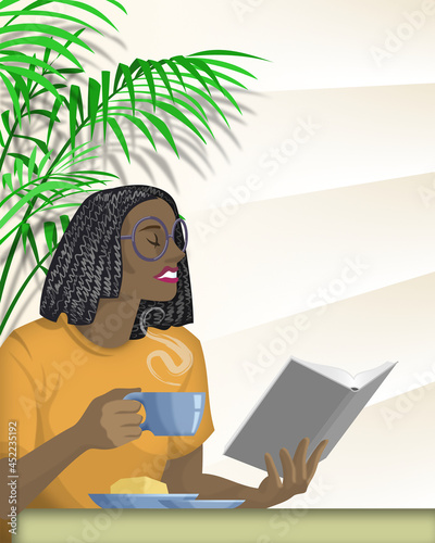 Young black female having morning coffee while reading a book