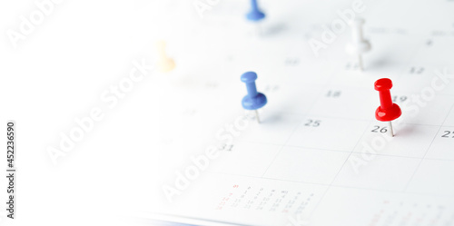 Thumbtack in calendar concept for busy, appointment and meeting reminder, planning for business meeting or travel planning concept.
