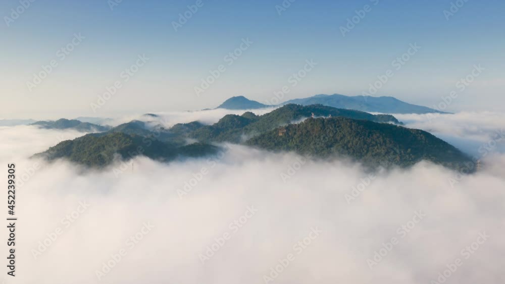 Hyper lapse by Drone, Beautiful Landscape in the morning time during sunrise with fog above the mountain, White fluffy clouds moving softly on cloudy, Pang puai Mae moh Lampang, Thailand. Hyper lapse by Drone, Beautiful Landscape in the morning time during sunrise with fog above the mountain, White fluffy clouds moving softly on cloudy, Pang puai Mae moh Lampang, Thailand.