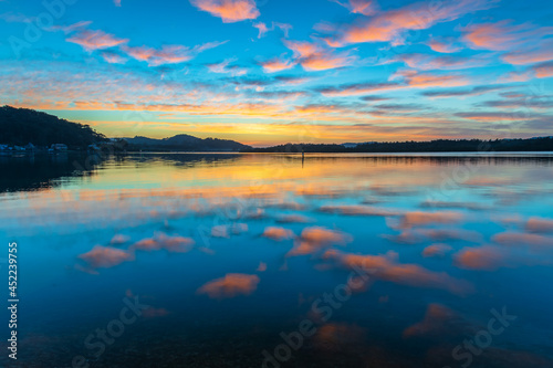 Fototapeta Naklejka Na Ścianę i Meble -  Sunrise waterscape with high cloud and reflections