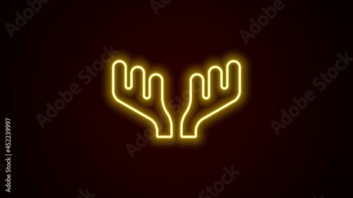 Glowing neon line Deer antlers icon isolated on black background. Hunting trophy on wall. 4K Video motion graphic animation