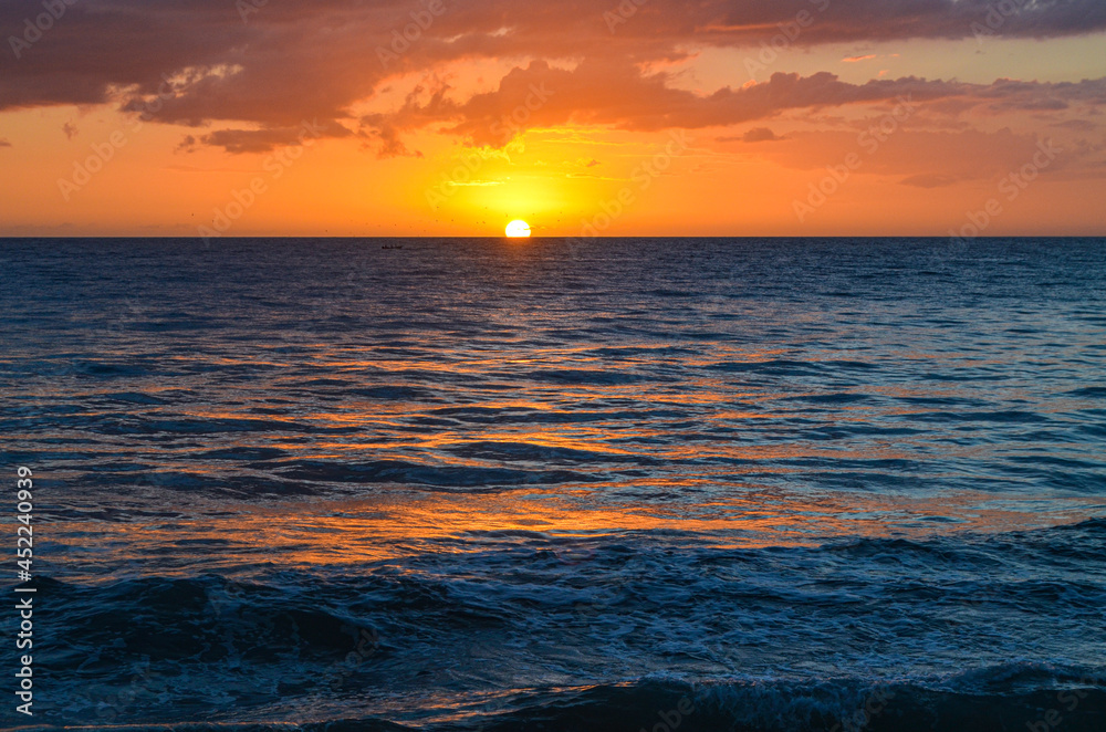 Perfect sunset on the western coast of Puerto Rico. Caribbean Sea. Rincon, PR. Copy space.
