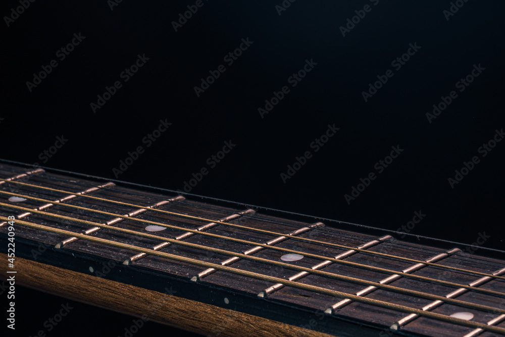 Fototapeta premium Close-up of an acoustic guitar fretboard copy space.
