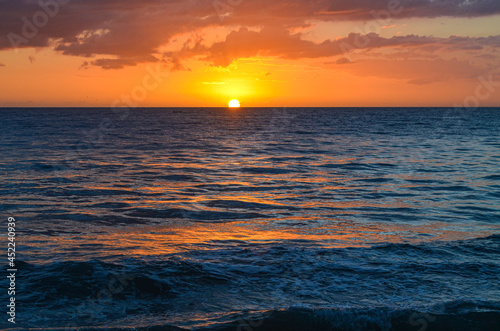 Perfect sunset on the western coast of Puerto Rico. Caribbean Sea. Rincon, PR. Copy space. 