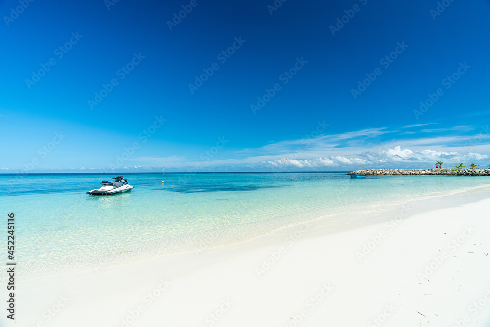Beautiful white sand beach and blue sky in Maafushi Island, Maldives