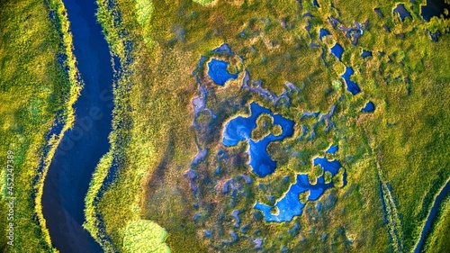 Aerial shot of Marsh land and grass around the Mullica river near Atlantic City in the Pine Barrens, New Jersey, USA