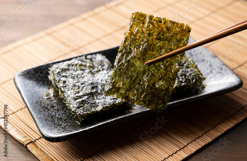 Korean seaweed on a wooden table. Asian food. photo