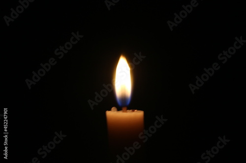 burning candle in the dark