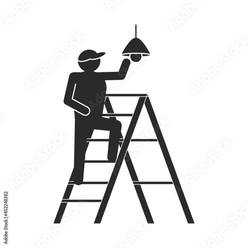 worker installing lamp