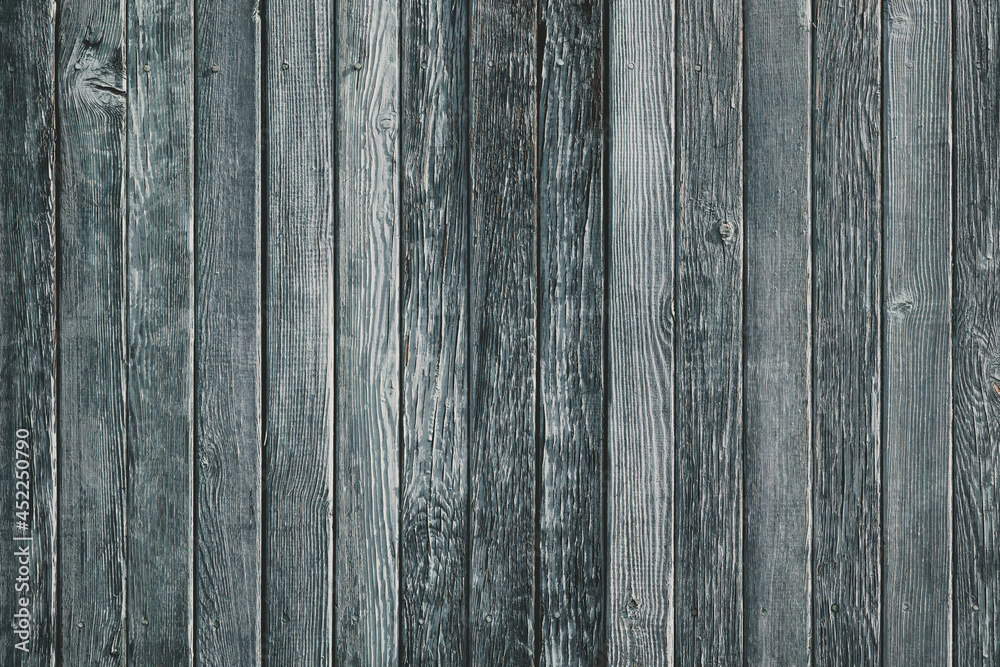 Naklejka premium Wooden planks on a wall or floor with grain and texture. antique cracking furniture painted weathered vintage peeling wallpaper.