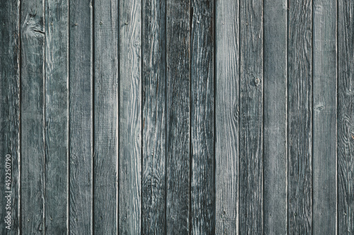 Wooden planks on a wall or floor with grain and texture. antique cracking furniture painted weathered vintage peeling wallpaper.