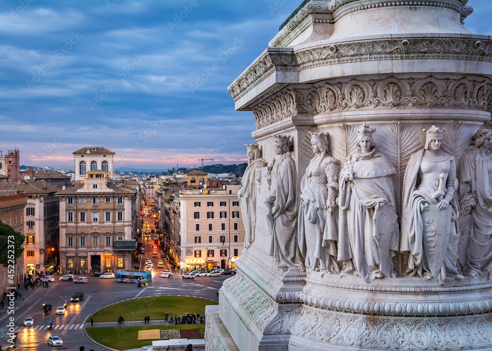 : A view of piazza di Venezia (square of Venice)  and the detail of huge marble stone base of Victor Emmanuel II statue, as seen from the  Altar of the Fatherland.  Rome, Italy