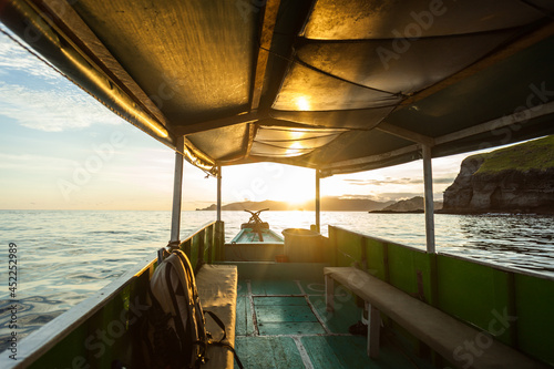 A boat on the way to Padar island during sunset