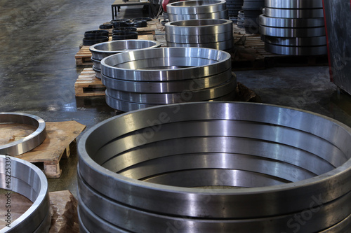 Ready-made large diameter bearings at the factory.Finished products of the bearing factory. Heavy industry concept. Metal products.
