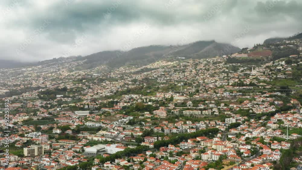 Madeira Islands, Portugal. Large coastal city within volcanic mountains. Aerial footage of magnificent island with exotic nature. High quality 4k footage Madeira Islands, Portugal. Large coastal city within volcanic mountains. Aerial footage of magnificent island with exotic nature. High quality 4k footage
