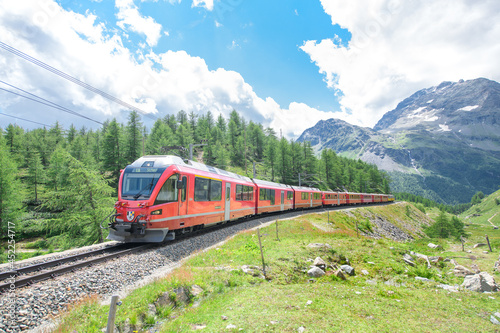 Bernina tourist train on the Swiss alps photo