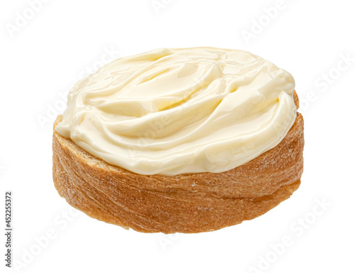 Slice of bread with cream cheese isolated on white background