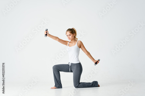 woman with dumbbells in hands fitness exercise energy workout