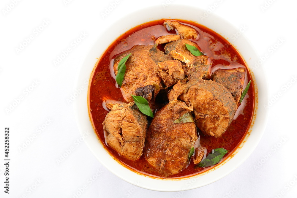 Kerala fish curry- homemade spicy king fish dish cooked with traditional recipes. Kerala fish curry- homemade spicy king fish dish cooked with traditional recipes.