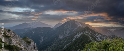 Panorama of a colorful sunset in the alps. View from the peak of the Herzogstand in Bavaria Germany