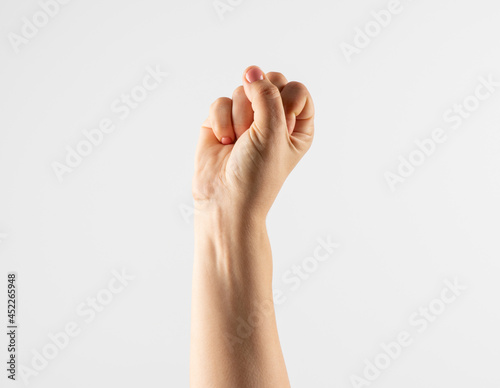 hand on white background. hand gesturing - the hand is gathered into a fist and stretched to the top,( victory,success,win) isolated on white background.
