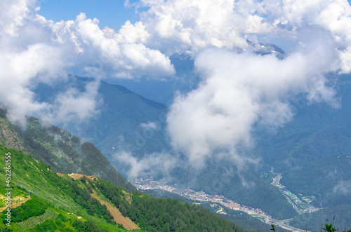 Fototapeta Naklejka Na Ścianę i Meble -  Beautiful Summer sunny mountains with clouds and meadow