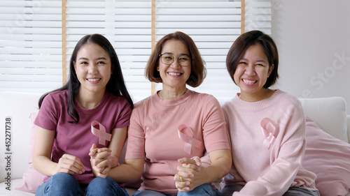 Diversity group asia happy people or senior mature lady and teen girl sit at home sofa smile look at camera to help fight prevent or protect female disease issue relief  patient health care benefit.
