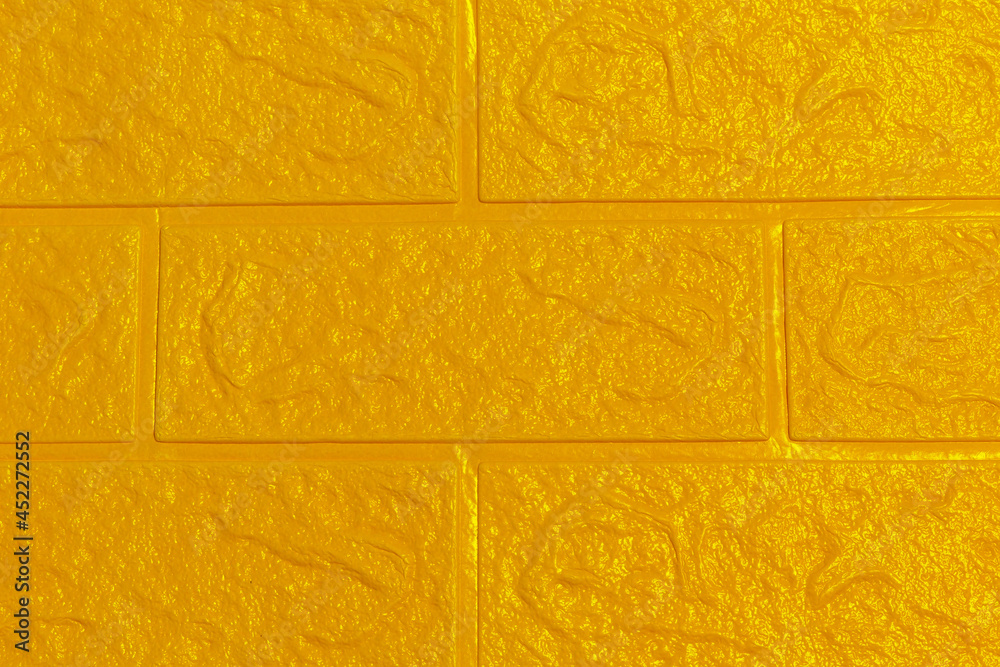The yellow gold wallpaper texture has an abstract roughness and brick ...