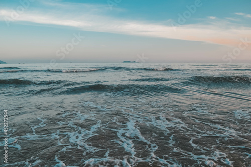 Green ocean shore and beach in Hainan island, China.
