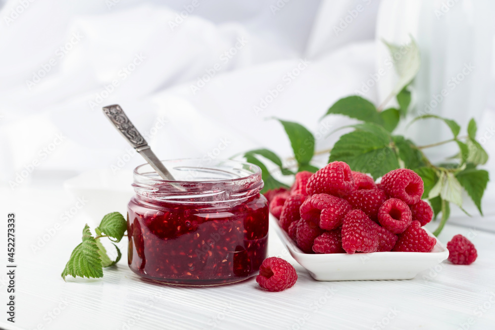 Jar of raspberry jam and fresh berries. Jar of raspberry jam and fresh berries.