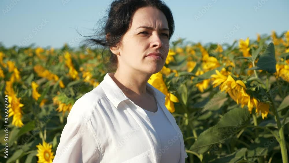 Young Woman Look at Sunflower Field. Female Agronomist Farmer Worker Inspect Crops Future Harvest. Summer Morning. 2x Slow motion 60fps 4K Young Woman Look at Sunflower Field. Female Agronomist Farmer Worker Inspect Crops Future Harvest. Summer Morning. 2x Slow motion 60fps 4K