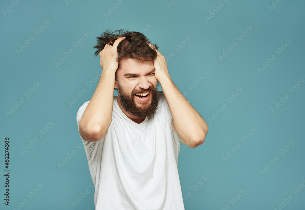 emotional man in a white t-shirt expressive look discontent Lifestyle emotional man in a white t-shirt expressive look discontent Lifestyle