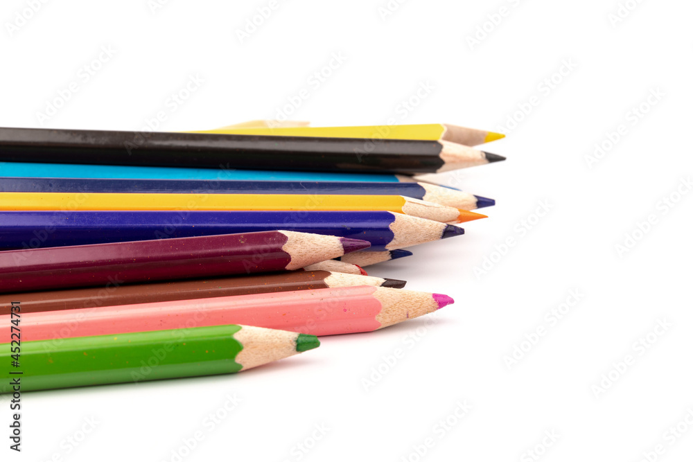 Colored pencils, school supplies drawing, pattern, copy space.