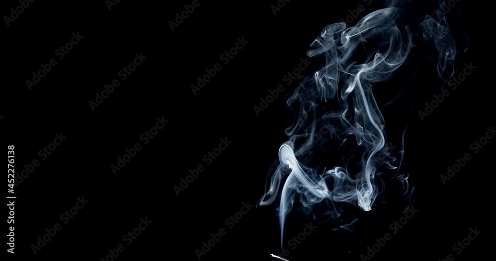Thin Flexible Trickle of Smoke. Graceful Bends of the Blue Smoke. Natural Colorful smoke rises up and spins into graceful spirals. Footage is perfect for the layer with different blending modes. Thin Flexible Trickle of Smoke. Graceful Bends of the Blue Smoke. Natural Colorful smoke rises up and spins into graceful spirals. Footage is perfect for the layer with different blending modes.