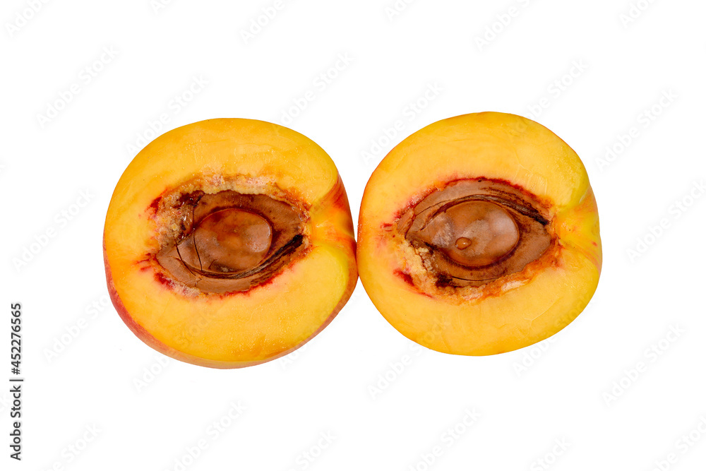 Beautiful peach halves isolated on white background