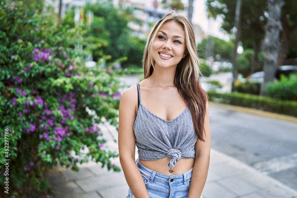 Young caucasian girl smiling happy standing at the city. Young caucasian girl smiling happy standing at the city.