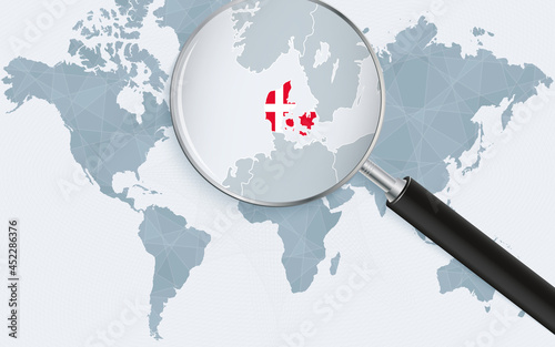 World map with a magnifying glass pointing at Denmark. Map of Denmark with the flag in the loop.