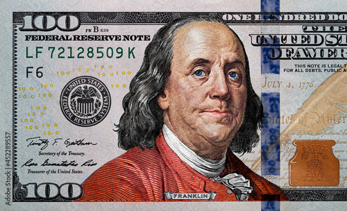 fragment of new colorized 100 dollar banknote