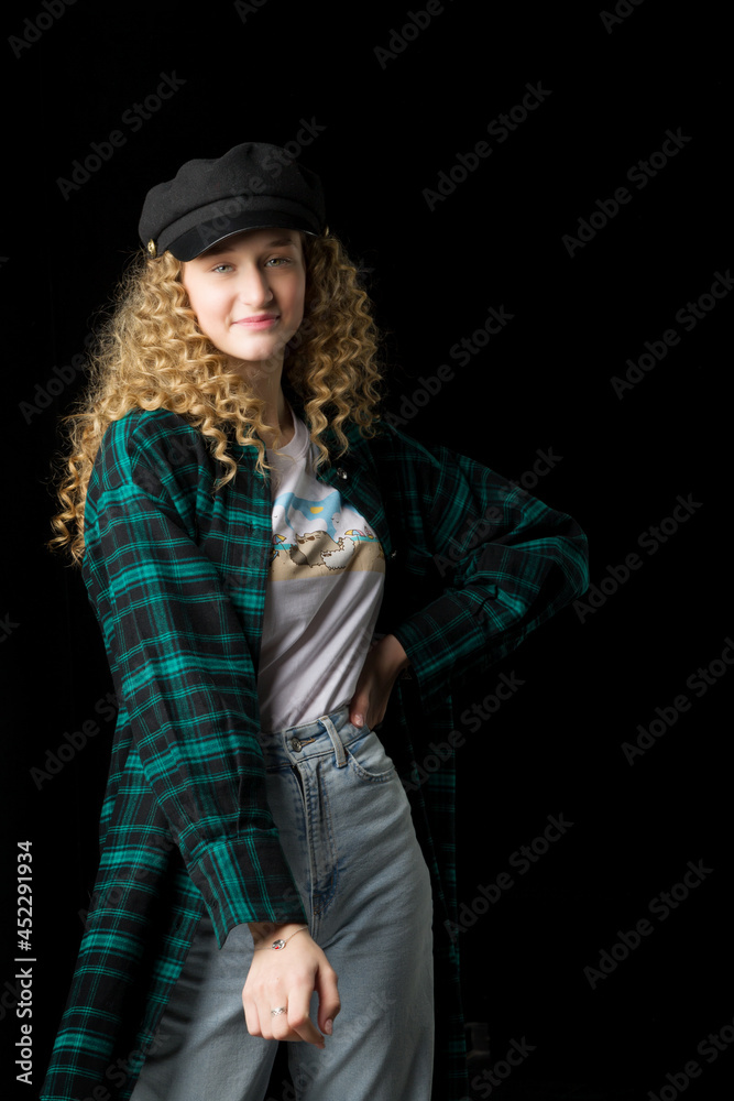 Beautiful girl standing with hands on her waist Beautiful girl standing with hands on her waist