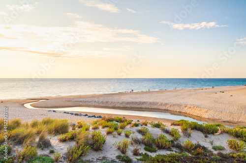 O Sullivan Beach view with people at sunset viewed from the esplanade  Fleurieu Peninsula  South Australia